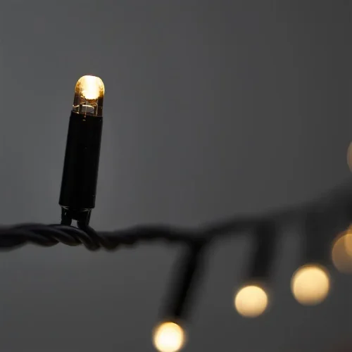 Гирлянда Нить с Колпачком 10м Тепло-Белая 220В, 100 LED, Провод Черный ПВХ, IP65. Фото 5.