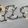Гирлянда Нить с Колпачком 10м Тепло-Белая 24В, 100 LED, Провод Черный ПВХ, IP65. Фото 3.
