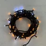 Гирлянда Нить 10м Желтая с Мерцанием Белого Диода 220В, 75 LED, Провод Черный Каучук, IP65. Фото 1.
