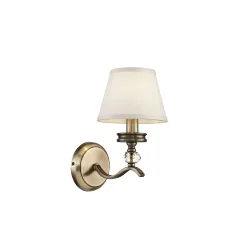 Элегантные светильники в классическом стиле. Металлическая арматура светильников Alessandra цвета бронзы сочетается с белым цветом абажуров из ткани. Абажуры окантованы лентой в тон. Дизайн арматуры дополнен декоративным элементом из стекла. (Бронза Антик