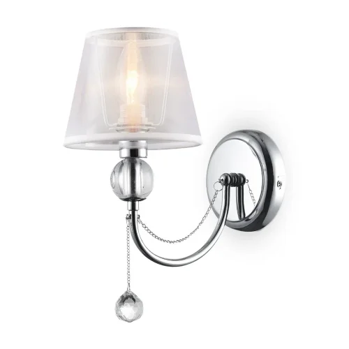 Светильники станут украшением интерьера, придадут ему шарм. Арматура светильников - из металла, а абажуры – из прозрачной органзы и ПВХ. Каждый из светильников серии дополнен тонкими серебристыми цепочками, а основания рожков украшены стеклянными прозрачн