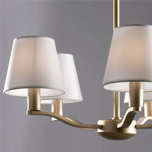 Серия Marika выполнена в современном стиле. Арматура золотого цвета сочетается с белыми абажурами из текстиля на ПВХ. Светильники подходят практически для всех современных интерьеров. (Золото) - фото 2