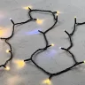 Гирлянда Нить 10м Тепло-Белая с Мерцанием Белого Диода 24В, 100 LED, Провод Черный ПВХ, IP54. Фото 3.