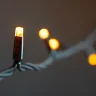 Гирлянда Нить 10м Желтая 220В, 100 LED, Провод Черный Каучук, IP65. Фото 5.