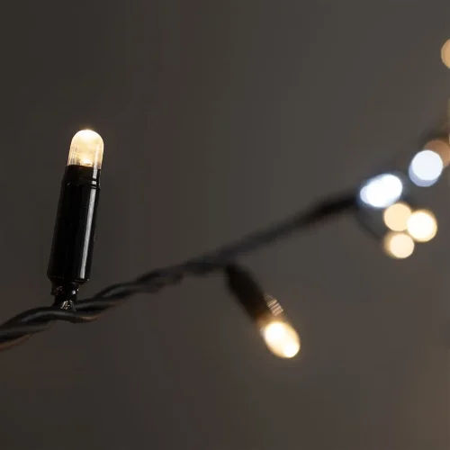 Гирлянда Нить 10м Тепло-Белая с Мерцанием Белого Диода 220В, 100 LED, Провод Черный Каучук 2,3мм, IP65. Фото 5.