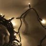 Гирлянда Нить 10м Тепло-Белая с Мерцанием Каждого Диода 220В, 100 LED, Провод Черный Каучук, IP65. Фото 4.