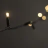 Гирлянда Нить 10м Тепло-Белая с Мерцанием Каждого Диода 220В, 100 LED, Провод Черный Каучук, IP65. Фото 5.