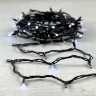 Гирлянда Нить 10м Белая с Мерцанием Каждого Диода 220В, 75 LED, Провод Черный Каучук, IP65. Фото 6.