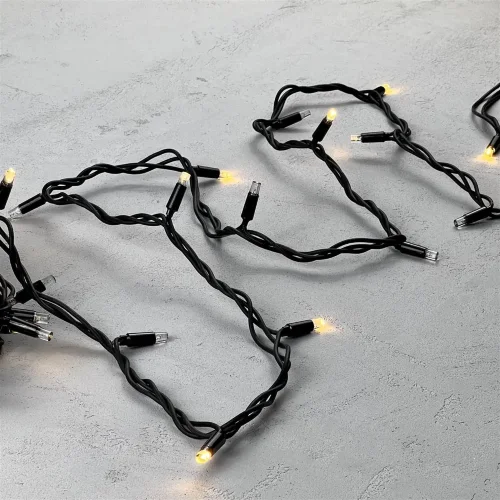 Гирлянда Нить 10м Тепло-Белая с Мерцанием Каждого Диода 220В, 75 LED, Провод Черный Каучук, IP65. Фото 3.