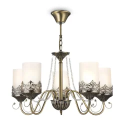 Нарядные и элегантные светильники — прекрасное решение для интерьеров в классическом стиле. Металлическая арматура окрашена в бронзовый цвет, цилиндрические плафоны из матового стекла обрамлены резным узором из металла, который перекликается с орнаментом 