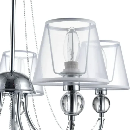 Светильники станут украшением интерьера, придадут ему шарм. Арматура светильников - из металла, а абажуры – из прозрачной органзы и ПВХ. Каждый из светильников серии дополнен тонкими серебристыми цепочками, а основания рожков украшены стеклянными прозрачн