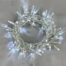 Гирлянда Нить с Колпачком 10м Белая с Мерцанием Белого Диода 24В, 100 LED, Провод Прозрачный ПВХ, IP65. Фото 1.