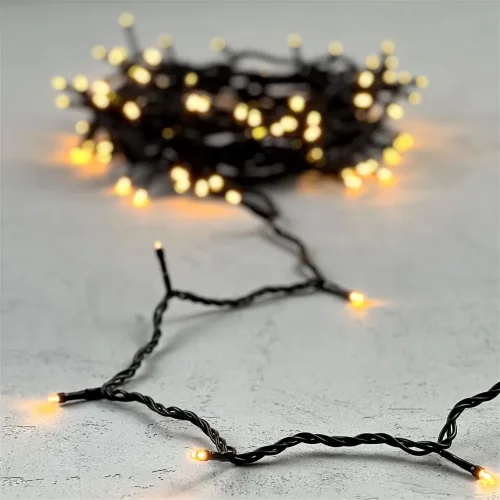 Гирлянда Нить 10м Экстра Тепло-Белая 24В, 100 LED, Провод Черный ПВХ, IP54. Фото 6.