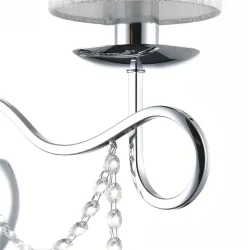 Нарядные и изящные светильники Morel выполнены в классическом стиле. Светлые абажуры сделаны из органзы, арматура – из металла цвета 'хром'. Каждый из светильников этой серии декорирован хрусталем в виде лент из кристаллов в форме октагонов и шара. (Хром)