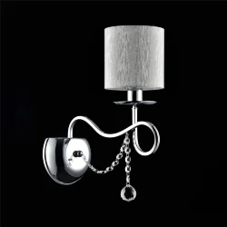 Нарядные и изящные светильники Morel выполнены в классическом стиле. Светлые абажуры сделаны из органзы, арматура – из металла цвета 'хром'. Каждый из светильников этой серии декорирован хрусталем в виде лент из кристаллов в форме октагонов и шара. (Хром)