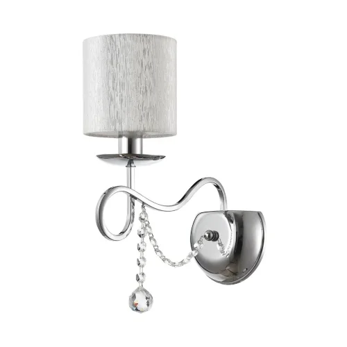 Нарядные и изящные светильники Morel выполнены в классическом стиле. Светлые абажуры сделаны из органзы, арматура – из металла цвета 'хром'. Каждый из светильников этой серии декорирован хрусталем в виде лент из кристаллов в форме октагонов и шара. (Хром)