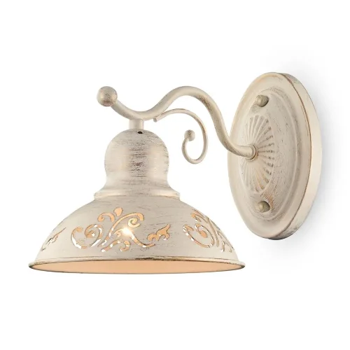 Светильники выполнены из металла цвета кремового золота. На плафонах светильников ажурно вырезаны узоры, прекрасно сочетающиеся с плавными изгибами арматуры. Благодаря большому ассортименту изделий серии Benoit легко выбрать светильник, подходящий как для