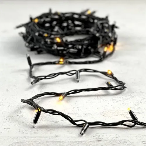 Гирлянда Нить 10м Желтая с Мерцанием Каждого Диода 220В, 100 LED, Провод Черный Каучук, IP65. Фото 5.