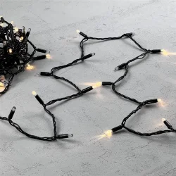 Гирлянда Нить с Колпачком 10м Тепло-Белая с Мерцанием Каждого Диода 24В, 100 LED, Провод Черный ПВХ, IP65