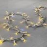 Гирлянда Нить с Колпачком 10м Тепло-Белая с Мерцанием Белого Диода, 300 LED, Провод Белый Каучук, IP65. Фото 2.