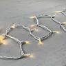 Гирлянда Нить 10м Тепло-Белая 24В, 75 LED, Провод Белый Каучук, IP65. Фото 3.
